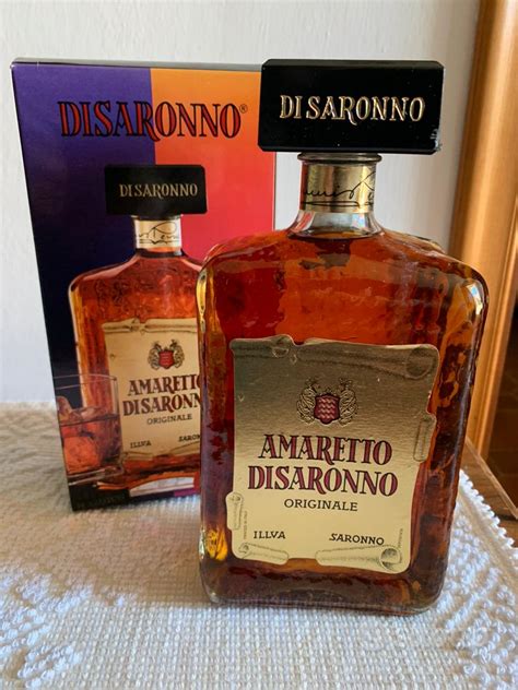 amaretto di saronno in scatola di latta versace